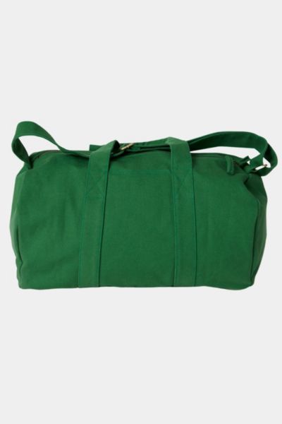 You won’t find a harder working duffle than the Aarde Gym Bag for daily outings, outdoor activities, traveling and more! Durable and versatile, it’s sustainably and ethically made with 14-oz heavy duty Fairtrade organic cotton canvas. The perfect size for a weekend trip or your daily workout, the Aarde Gym Bag has an adjustable shoulder strap, an outside drop-in pocket and an internal zippered pocket for keeping small items secure and accessible. Content + Care Made with 14-oz Certified Fairtrad Green Large Capacity Bag For Outdoor Activities, Large Capacity Green Bag For Outdoor Activities, Casual Green Travel Bag For Daily Use, Casual Green Rectangular Gym Bag, Casual Green Tote Duffle Bag, Casual Cotton Duffle Bag With Large Capacity, Versatile Green Gym Bag, Versatile Green Duffle Bag, Practical Cotton Duffle Bag For Everyday