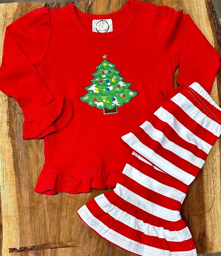 "Hi and Welcome to my store.  Thank you for stopping by to check out our cute little frill Christmas outfit.  I can add her name under the tree. Just add that at checkout in the comments to me.  The pants are stretchy so they fit well.  These shirts and pants are super soft and comfy.  Please let me know if you don't see your size. *Please note that I personalize the dresses, another company makes them.  💕 Our current production time is 5-7 days plus shipping time. If I need to order your item it will add 5 days to the process.    If you are needing a rush order please add the \"Rush My Order\" listing from my shop.  (please message me before you purchase this to make sure I have your item in stock)   https://www.etsy.com/listing/545381716/rush-my-order-1-2-day-processing-time? Thank you Cute Festive Winter Sets, Christmas Outfit For Kids Girl, Festive Winter Cotton Sets, Festive Cotton Sets For Winter, Cotton Festive Winter Sets, Festive Long Sleeve Winter Sets, Holiday Long Sleeve Cotton Sets, Cotton Long Sleeve Sets For Holiday, Holiday Long Sleeve Sets For Fall