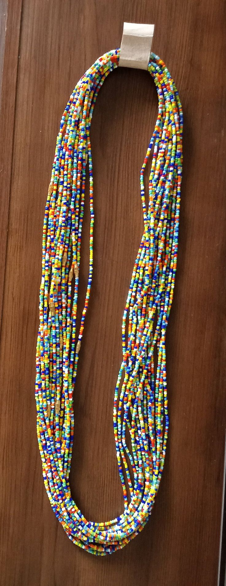 Waist bead These beaded waist band is made of small colorful glass bead, string and brass clasps. Size: 36 inches (Available in all sizes that can perfectly fit your waist, please request your order) Place the tape measure at the exact area you prefer to wear the waist beads. Make sure you get the right measurement. [we have uploaded many photos for you to have many choices, also you can request a mix of different colors of those we have uploaded] Made in Kenya. Fine finish. For bulk purchase pl Multicolor Waist Beads With Large Beads For Festival, Hand-strung Multicolor Round Beaded Necklaces, Multicolor Large Beaded Waist Beads For Festival, Multicolor Large Beaded Waist Jewelry For Festival, Adjustable Multicolor Waist Beads With Large Beads, Multicolor Tiny Beads Waist Beads For Festival, Multicolor Large Beads Waist Beads For Gift, Multicolor Large Beads Waist Beads As Gift, Multicolor Tiny Beads Waist Jewelry For Festival