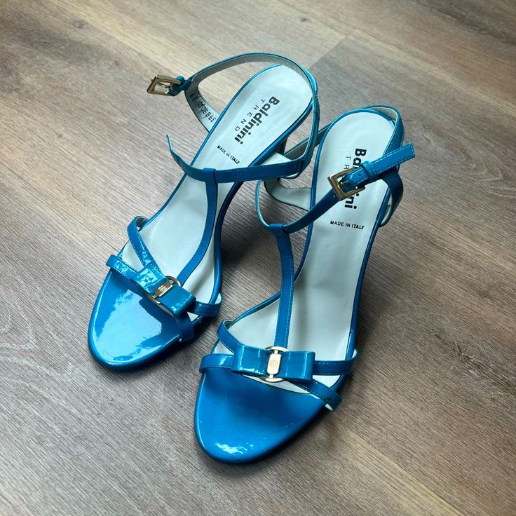 Brand: Baldinini Color: Blue Size: 39 European Condition: Like New, Never Worn Blue Patent Leather Summer Heels, Blue Patent Leather Heels For Summer, Blue Patent Leather Evening Sandals, Blue Patent Leather Open Heel Heels, Elegant Blue Sandals With 4-inch Heel, Elegant Blue Sandals With Padded Heel, Elegant High Heel Blue Sandals, Blue Patent Leather Heels With Ankle Strap, Elegant Blue Patent Leather Sandals