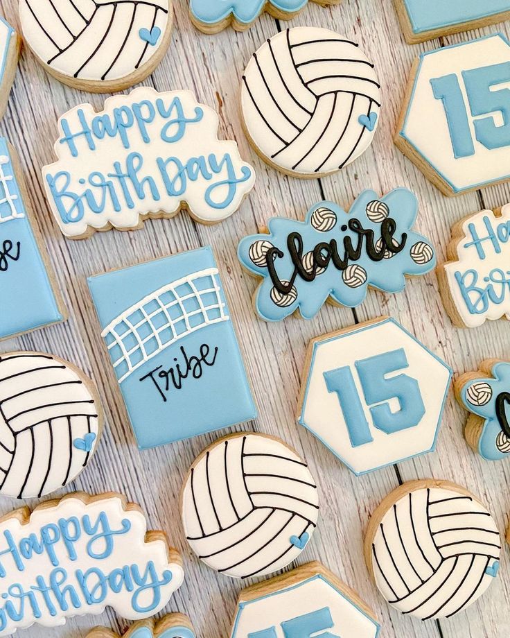 decorated cookies are arranged in the shape of volleyball balls and numbers, with happy birthday written on them