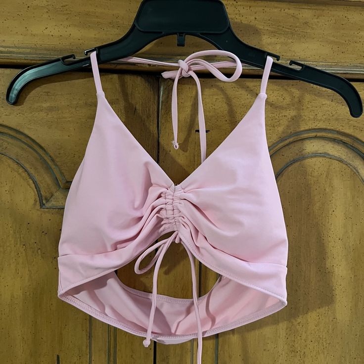 80% Nylon 20% Spandex Pink Stretch Halter Top For Swimming, Trendy Pink Halter Top For Beach, Seamless Swimwear For Spring Party, Seamless Party Swimwear For Spring, Pink Fitted Halter Top For Beach Party, Fitted Pink Halter Top For Beach Party, Pink Halter Top For Swimming In Spring, Pink Halter Top For Pool And Spring Season, Spring Seamless Halter Top For Swimming