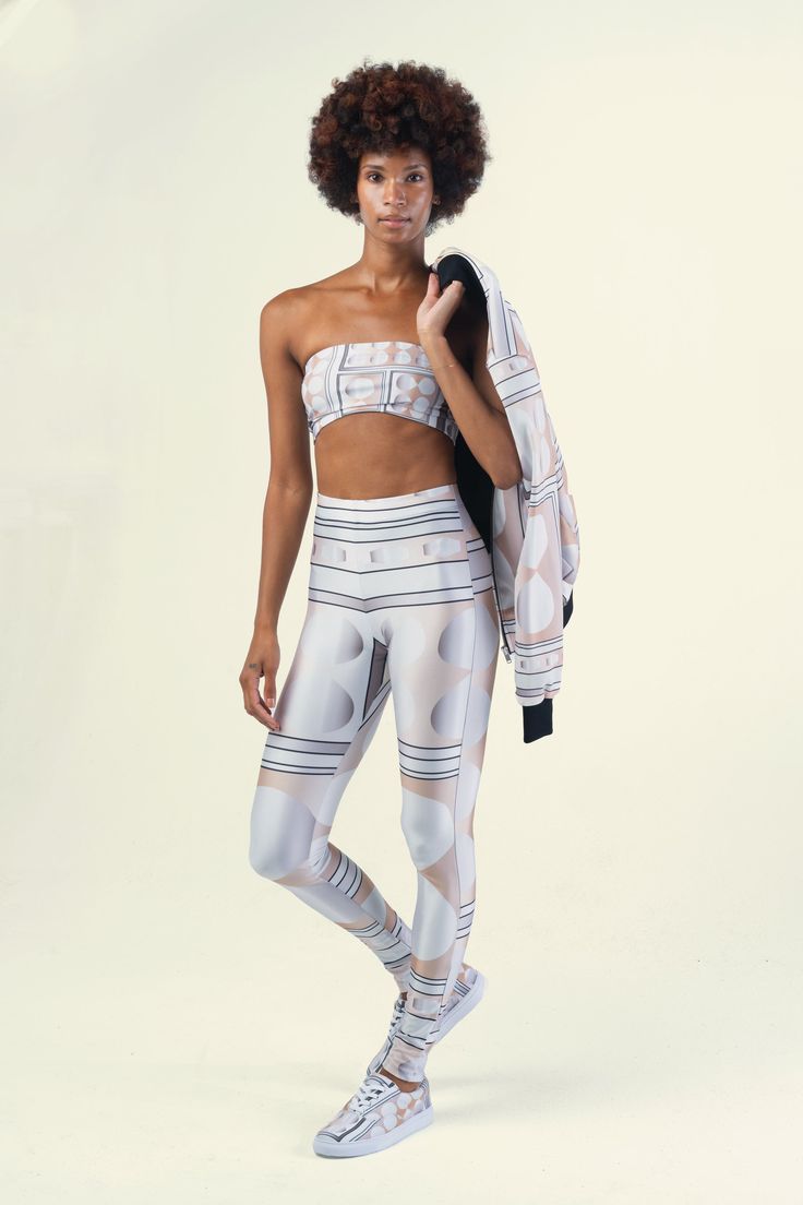 Athleisure Wear at its finest, featuring artist Sharon A. Keyser’s original Infinity design in Champagne. The Collection debuted on the runway for New York Fashion Week and sports a modern Bomber Jacket, Bandeau Top, Leggings and matching Canvas Lace-Up Sneakers. The garments are comfortable, casual and easy to wear, with an upscale visual appeal that makes them perfect for even non-athletic social settings. Each item is sold separately. Bomber Jacket: Softshell Jersey Outer with Satin Lining So Fitted Athleisure Activewear With Reflective Details, Trendy White Fitted Activewear, Modern Fitted Activewear For Workout, Fitted Athleisure Activewear For Streetwear, Modern Fitted Activewear, Chic Spring Sports Activewear, Athleisure Activewear With 4-way Stretch And Cropped Design, Printed Fitted Sporty Activewear, Infinity Design