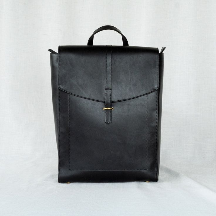 Atlas leather backpack product shot in black Classic Travel Bag Standard Backpack, Classic Rectangular Travel Backpack, Classic Laptop Bag Backpack For Everyday Use, Classic Backpack With Luggage Sleeve For Everyday Use, Classic Backpack With Leather Handles For Daily Use, Classic Backpack With Luggage Sleeve, Travel Backpack Satchel, Classic Travel Backpack Satchel, Classic Black Laptop Backpack