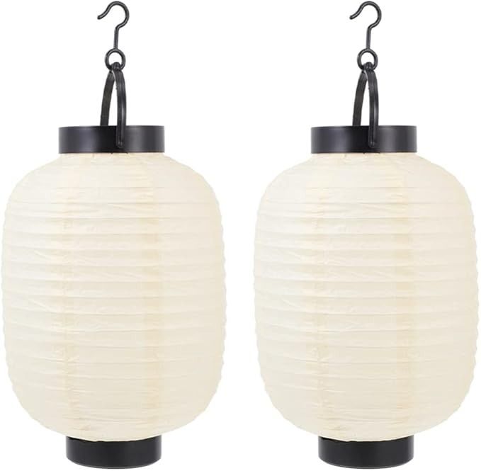 two white paper lanterns hanging from hooks