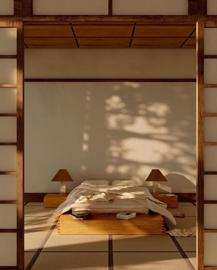 a bed sitting in the middle of a room next to two lamps