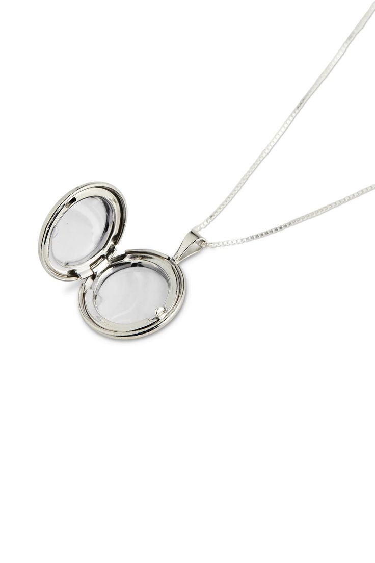 Elegant and and timeless our Classic Locket is a forever piece for the modern sentimental. Featuring a round, slightly convex locket that has a shiny finish hanging from a 1mm 20" Box Chain. 20" Box Chain Stearling silver Classic Locket Necklace With Adjustable Chain As Gift, Classic Nickel-free Locket Necklace As Gift, Classic Nickel Free Locket Necklace For Gift, Classic Nickel-free Locket Necklace Gift, Silver Oval Locket Necklace With Adjustable Chain, Silver Medallion Locket Necklace Gift, Silver Round Locket Necklace For Formal Occasion, Formal Silver Round Locket Necklace, Classic Nickel Free Silver Locket Necklace