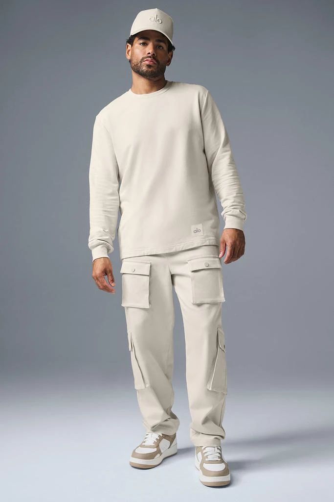 Thick and substantial with just-right drape, think of the Double Take as a leveled-up version of your favorite long sleeve. The fit is a touch oversized (in a cool way, not a slouchy way) with slightly extended sleeves, ribbed cuffs and a slightly extended hem. Wear it with baggy cargos, casual shorts or any time you want to look put-together with minimal effort. Relaxed Fit Long Sleeve Top With Cargo Pockets, Long Sleeve Alo Yoga Tops For Fall, Oversized Long Sleeve Top With Cargo Pockets, Alo Yoga Long Sleeve Tops For Fall, Long Sleeve Tops With Cargo Pockets For Streetwear, Streetwear Long Sleeve Tops With Cargo Pockets, Alo Yoga Oversized Sweatshirt For Fall, White Long Sleeve Alo Yoga Top, Alo Yoga Relaxed Fit Tops For Fall