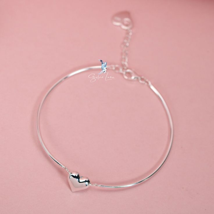 This beautifully crafted bracelet showcases two linked bangle pieces, complete with an adjustable chain and a charming heart-shaped charm. Made of high-quality 925 sterling silver, it makes for an exceptional Valentine's gift for your special someone. Treat your loved one to a piece of jewelry that is as stunning as it is meaningful. The Solid silver Valentine heart half bangle bracelet is a symbol of your love, beautifully crafted from 925 sterling silver and complete with an adjustable chain f Heart Shape Bracelet, Plate Jewelry, Heart Bangle Bracelet, Chain Heart, For Your Love, Valentine's Gift, Silver Bangle Bracelets, Valentine Gift, Bracelet Silver