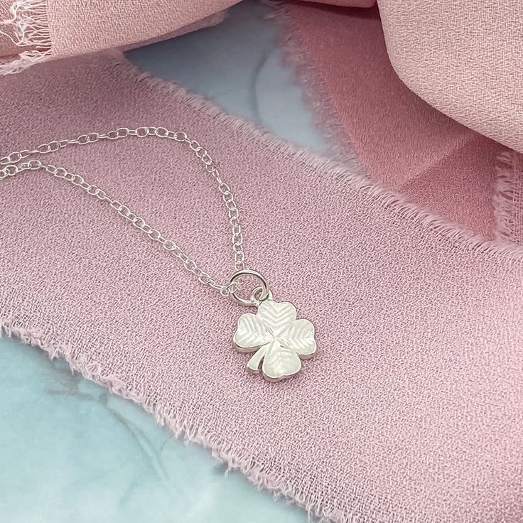 A dainty Silver Initial Charm Necklace with a lucky Four Leaf Clover. This dainty necklace is ideal for layering or wearing as a stand-alone signature necklace. • D E T A I L S •• 10mm charms• Sterling Silver• Dainty Style• 3 chain lengths available (16, 18, and 20 inches) Dainty Round Pendant Charm Necklace For Good Luck, Dainty Necklace With Adjustable Chain For Good Luck, Tiny Delicate Pendant Charm Necklace, Good Luck Charm Necklace With Delicate Chain, Dainty Nickel Free Flower Pendant Charm Necklace, Good Luck Sterling Silver Necklace With Delicate Chain, Dainty Nickel-free Flower Pendant Charm Necklace, Dainty Small Charm Necklace For Everyday, Dainty Sterling Silver Flower Pendant Charm Necklace