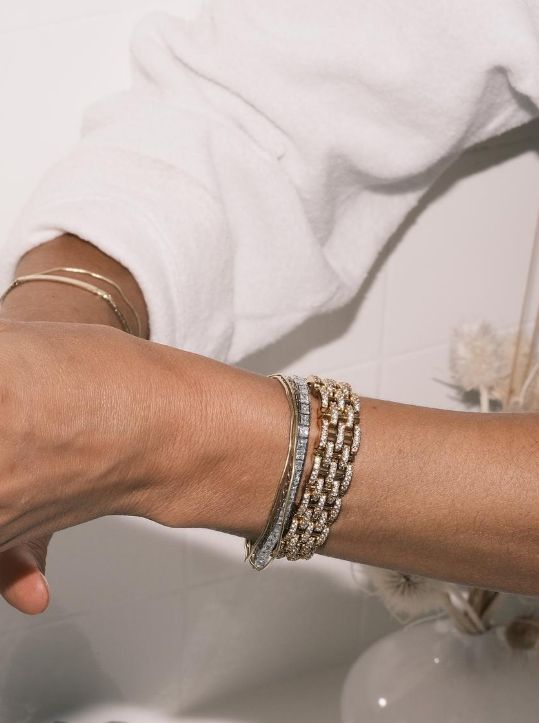 Our 5-row, pavé crystal chain sits gracefully atop the wrist - but don’t be deceived - the Bendetta bracelet is anything but dainty. Inspired by the gold link sets of the 1930’s, she can be styled alone or loaded up with our Dorsey and Kate riviera bracelets (shown here). Stats: Length: 6.5 Inches Gold plated, brass Pavé crystal Pave Bracelet, The Fine Print, Gold Link, Sapphire Bracelet, Crystal Chain, Gold Price, Bracelet Gold, White Sapphire, We Wear