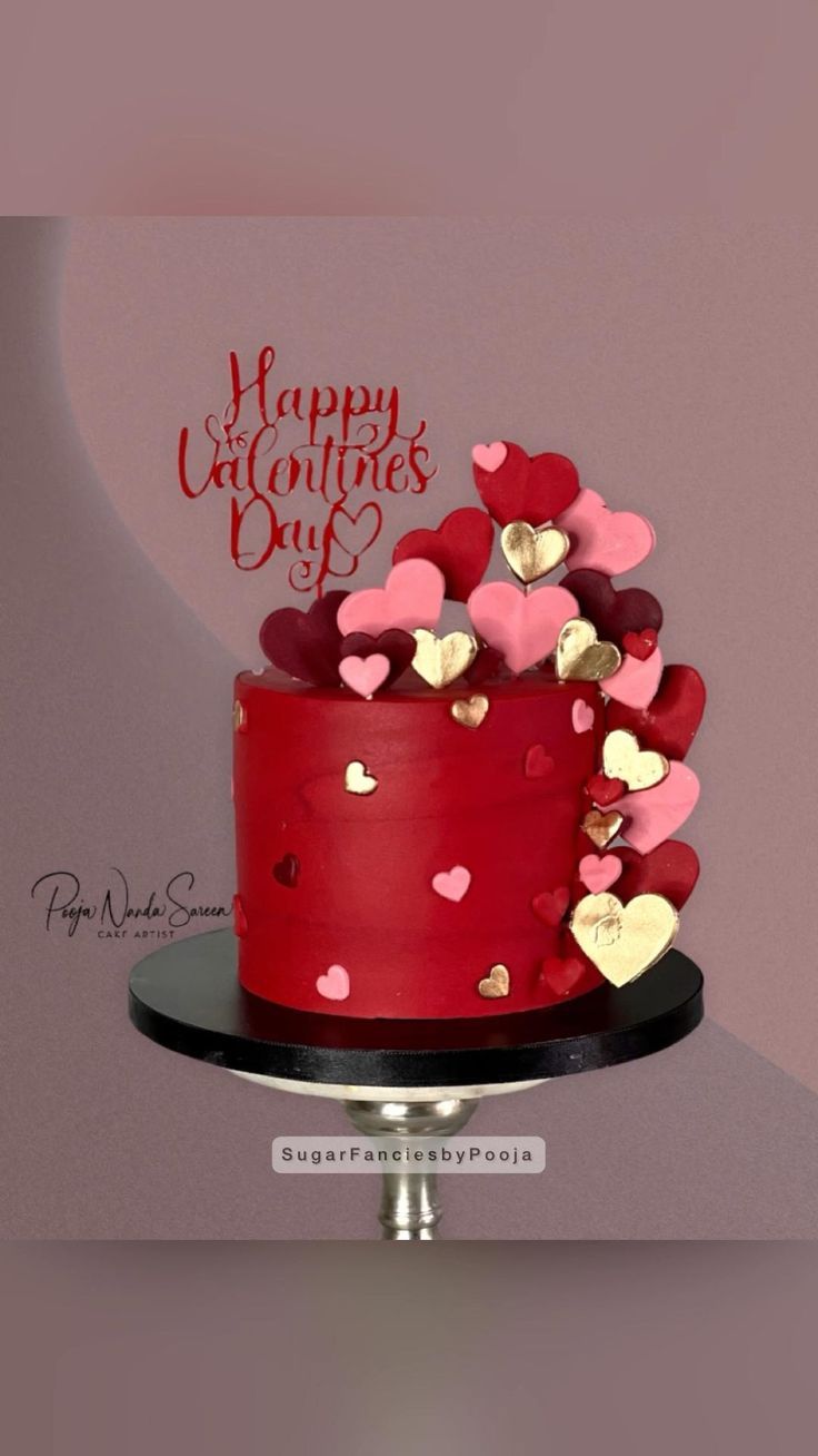 a valentine's day cake with hearts on it and the words happy valentine's day