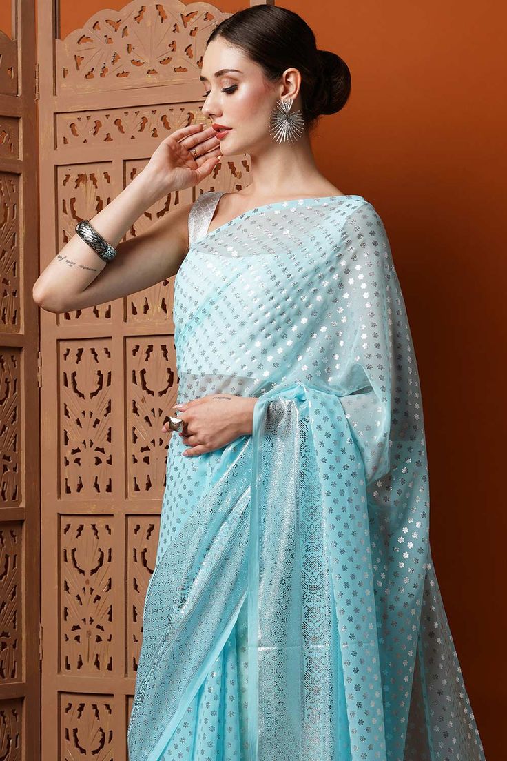 Iris Light Blue Georgette Foil Print One Minute Saree Festive Floor-length Blue Pre-draped Saree, Festive Blue Floor-length Pre-draped Saree, Blue Pre-draped Saree For Diwali Party, Festive Light Blue Blouse Piece For Party, Festive Light Blue Blouse For Party, Festive Light Blue Party Blouse, Blue Pre-draped Saree With Cutdana For Party, Blue Cutdana Pre-draped Saree For Party, Blue Traditional Wear With Unstitched Blouse For Party