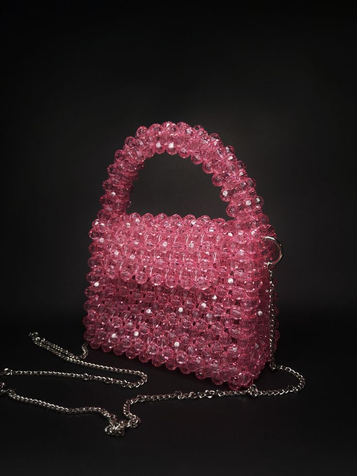 Pink Handmade bag of beads  Beaded handbags are a great option for formal events, evening events and for every day. They can become a bright accent of your image. The texture of the beaded bag not only adds visual interest, but also creates a luxurious and tactile feel. This bag will also be a great gift for your loved ones. The bag is woven from fishing line that can withstand weight up to 35 kg. It is very secure as it closes with a magnetic clasp. Thanks to the fabric lining, the bag is not see-through. 100% handmade Material: beads with a diameter of 6 mm. Size: > width - 16 cm | 6.2 inches > height - 12 cm | 4.7 inches > side width - 7 cm | 2.7 inches The kit includes a 1 m long steel chain. Lining: cotton. Worldwide delivery by postal services with assigned tracking number. Shipping Cheap Beaded Pink Shoulder Bag, Beaded Top Handle Evening Shoulder Bag, Beaded Evening Shoulder Bag With Top Handle, Beaded Top Handle Shoulder Bag For Evening, Evening Beaded Top Handle Shoulder Bag, Beaded Top Handle Evening Bag, Evening Top Handle Bag With Beaded Details, Pink Sequin Evening Bag, Pink Beaded Formal Bags