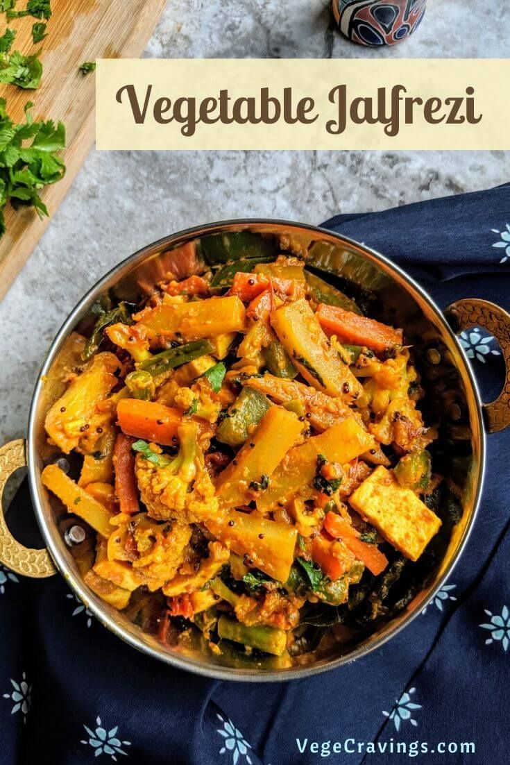 vegetable jalfrezi in a pan on top of a blue table cloth with the title