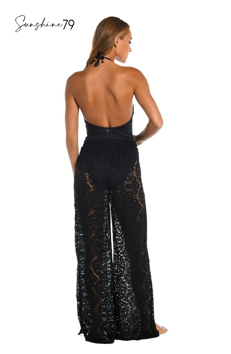 With a breezy boho vibe, these sophisticated palazzo pants from Sunshine 79 offer the crocheted look you've been searching for. Pull on over your favorite swimsuit for a chic cover-up or pair with a cami for an elevated look that's completely effortless. A waist tie finished with gold logo cord ends offers an adjustable fit. [split] Details Beach pants Adjustable waist tie Gold logo cord ends Wide, palazzo-style legs Fabric 100% Cotton Bohemian Maxi Bottoms For Beach Season, Bohemian Maxi Beach Bottoms, Bohemian Maxi-length Beach Bottoms, Stretch Maxi Length Bottoms For Beach, Bohemian Maxi Bottoms For Vacation, Fitted Lace Beachwear Bottoms, Elegant Summer Wide Leg Beach Pants, Black Summer Bottoms For Beach Cover-up, Summer Beach Maxi Bottoms