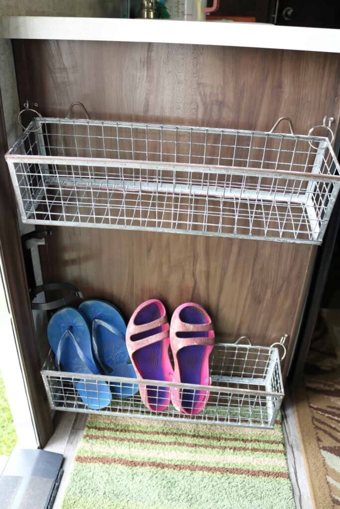 two pairs of shoes are sitting in the closet