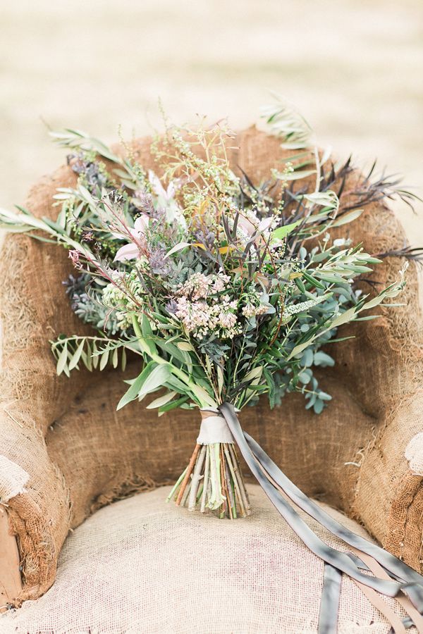 a bouquet of flowers sitting on an old chair