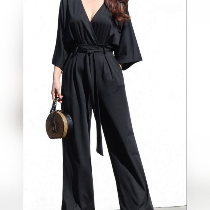 Look Chic And Elevated With Our V Neck Venetian Jumpsuit With Tie. This Wide Leg Jumpsuit Features A V Neckline, Back Waist Elastic, Side Pockets, And Stretch Fabric For A Comfortable Fit. The Perfect Jumpsuit For Any Occasion! Model Is 5’5” Size Small. Fit: True To Size Polyester Has A Nice Stretch Not See Through Wide Leg Strapless Romper, Loungewear Jumpsuit, Short Sleeve Romper, Red Jumpsuit, Printed Rompers, Sleeved Romper, Black Romper, Long Sleeve Romper, Wide Leg Jumpsuit