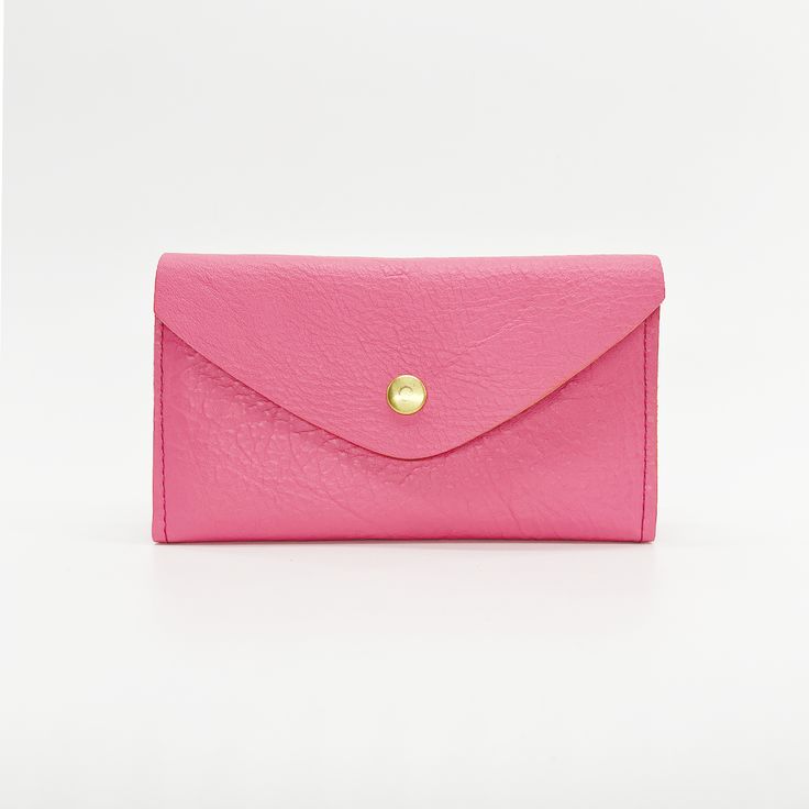 PinkTHE wallet. Functions like a dream, holds all you need, doubles as a clutch. Available in a myriad of colorful leather options, so you can choose the one that is perfectly you. This classic design features 6 credit card slots, a compartment for organizing bills and receipts, and a back zippered coin pocket— all in a slender silhouette. The sleeve of this wallet also holds your phone, so feel free to carry it solo anytime you feel like getting dressed up. Available in soft chrome tanned leath Modern Bifold Clutch With Card Slots, Modern Clutch With Card Slots For Daily Use, Classic Pouch Clutch With Card Slots, Modern Clutch For Daily Use With Card Slots, Modern Envelope Wallets For Everyday Use, Pink Travel Wallet With Card Slots, Pink Clutch With Interior Card Slots For Gift, Everyday Trifold Clutch With Card Slots, Versatile Clutch Wallet With Interior Card Slots