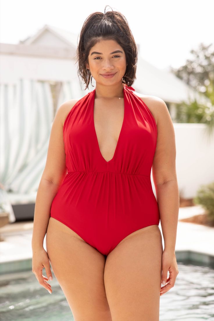 We absolutely love this swimsuit! This swimsuit has a fierce red color that's perfect for the season! It has a classic one-piece fit, features a tied halter neckline, and has the cutest keyhole bust! Wear this swimwear to every pool party on your calendar this Summer! #curvy #fashionoutfits #womensfashion #weekendvibes #saturdaystyle #trendyoutfit #swim #swimwear #bathingsuit #swimsuits2021 Solid Color Ruched V-neck Swimwear, Solid V-neck Ruched Swimwear, Red Ruched Swimwear For Party, Ruched V-neck Swimwear, V-neck Ruched Tankini For Swimming, Fitted V-neck Swimwear For Holiday, Red Ruched Swimwear For Beach Season, Red Ruched One-piece Swimwear, Red Ruched Sleeveless Swimwear