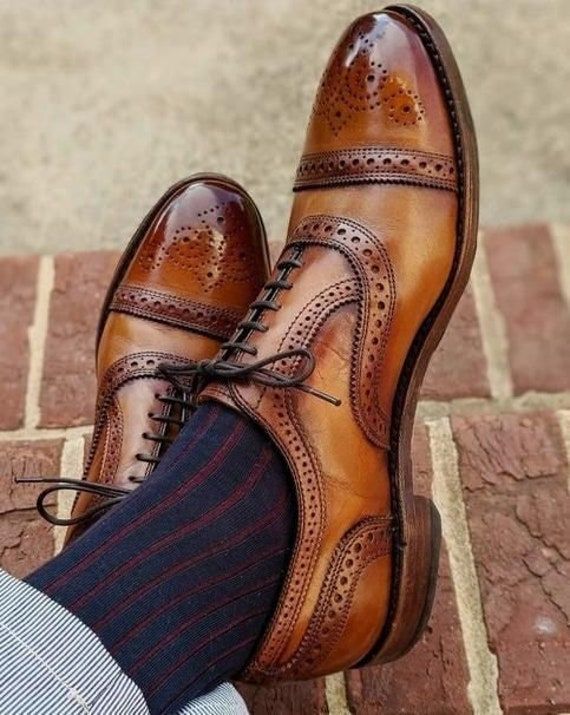 These handmade brogue oxfords are the type of shoes you would go for everyday wear, they are that much great. For more designs in men's handmade shoes section please follow the link below. https://www.etsy.com/shop/BarismilLeathers?ref=seller-platform-mcnav&section_id=27704663   Handmade leather shoes for men custom made leather shoes for men.  These cow leather with patina hand finish shoes are men's must have. Fine quality leather on the outside, the uppers of these shoes.  The inside of these Masculine Fitted Oxfords With Leather Sole, Fitted Masculine Oxfords With Leather Sole, Fitted Leather Sole Oxfords, Fitted Masculine Wingtip Oxfords, Masculine Fitted Wingtip Oxfords, Vintage Brown Monk Strap Shoes With Brogue Detailing, Vintage Monk Strap Shoes With Brogue Detailing, Masculine Almond Toe Oxfords With Brogue Detailing, Brown Cap Toe Oxfords With Brogue Detailing