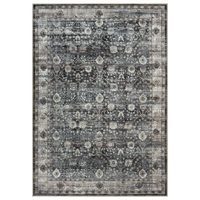 an area rug with grey and white colors