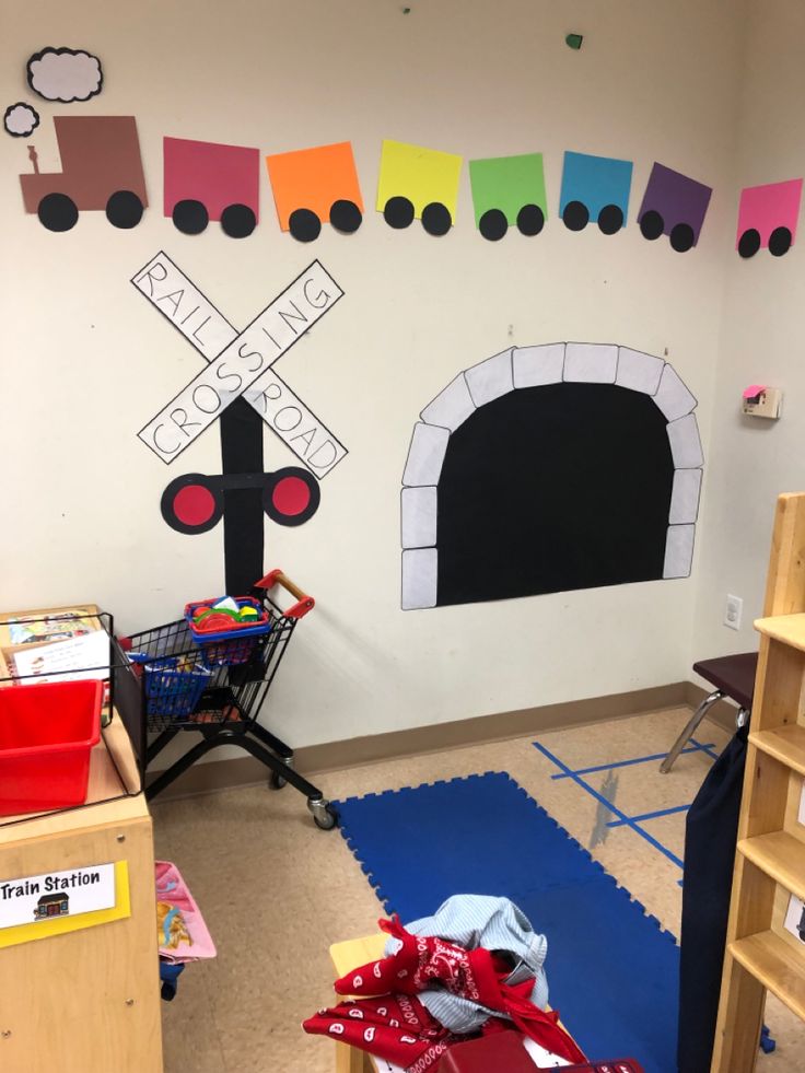 a child's playroom with lots of toys on the floor and walls painted in different colors