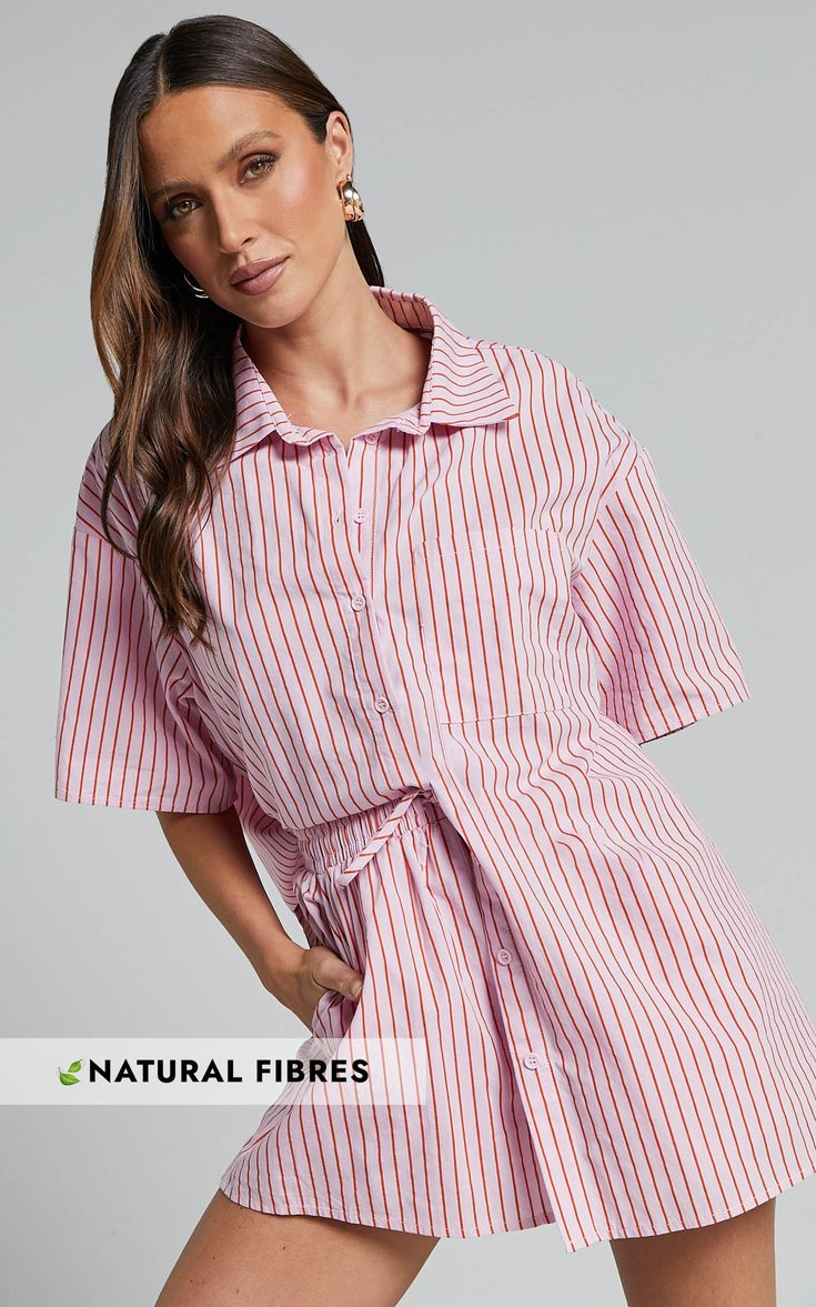 Stand out from the crowd this summer with our Gijon Shirt in Pink and Red Stripe! This collared button-through shirt is a must-have for any fashion-forward individual. Made from lightweight poplin cotton, it's perfect for those hot days when you want to stay cool and comfortable. With its short sleeves and standard collar, this casual top can easily be dressed up or down to suit any occasion. Whether you're heading to the office or meeting friends for brunch, our Gijon Shirt is sure to make a st Red Tops For Summer Loungewear, Red Summer Loungewear Tops, Summer Button-up Shirt For Workwear, Summer Button-up Workwear Shirt, Pink Shirt For Workwear In Summer, Summer Workwear Button-up Shirt, Pink Summer Workwear Shirt, Summer Lounge Shirt With Button Closure, Pink Button-up Shirt For Loungewear