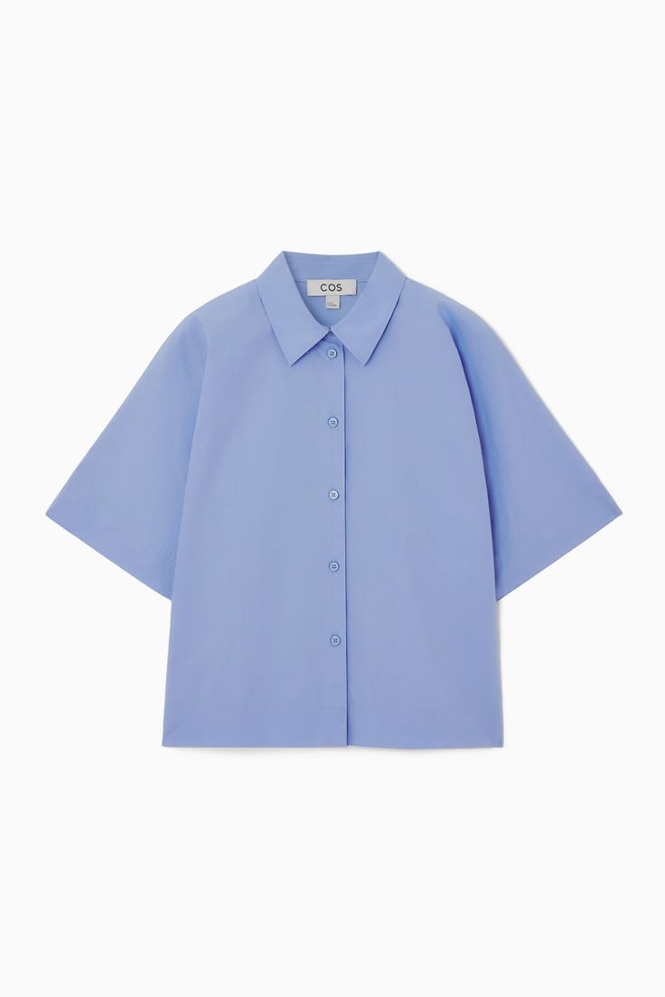 Swap out your long-sleeved shirts for this summery version as the weather warms. It's crafted from pure cotton-poplin that has a naturally breathable quality and designed in a slightly boxy shape that'll work just as well tucked in as it will left loose over skirts and pants.- Regular fit- Button closure- Short sleeves100% Cotton / Machine washBack length of size  6 is 22.04" / Model wears a size 6 Cotton Relaxed Fit Camp Shirt For Daywear, Relaxed Fit Cotton Camp Shirt For Daywear, Spring Solid Cotton Camp Shirt, Short Sleeve Poplin Tops For Work, Short Sleeve Poplin Blouse For Spring, Relaxed Cotton Camp Shirt For Daywear, Long Sleeve Poplin Tops For Summer, Spring Short Sleeve Poplin Blouse, Collared Cotton Short Sleeve Shirt For Daywear