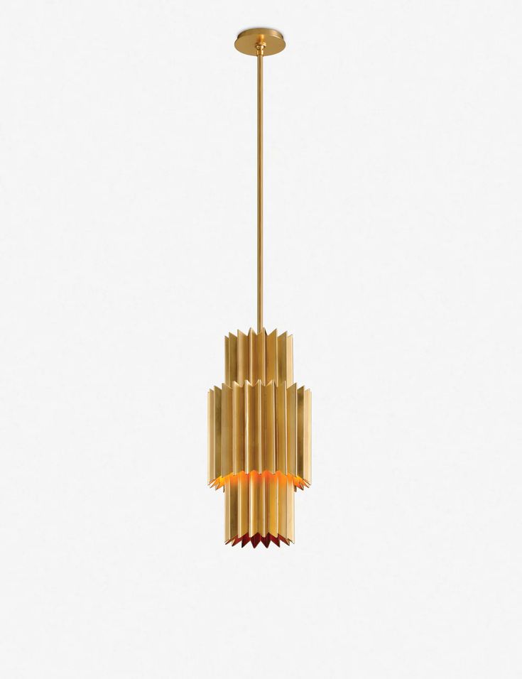 a gold colored chandelier hanging from a ceiling fixture with an orange light in the center