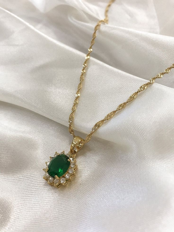 "PRODUCT DETAILS: - CZ encrusted crystal water-drop pendant in emerald green - 24k gold plated rope chain - 18\" chain - 2.5 cm pendant" Elegant Gold Necklace Classy, Emerald Jewelry Necklace, Emerald Necklace Pendant, Pendant Necklace Gold, Inspired Necklace, Prom Jewelry, Green Jewelry, Emerald Pendant, Cz Pendant