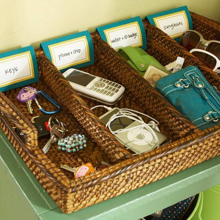 two baskets filled with items sitting on top of a green table next to each other