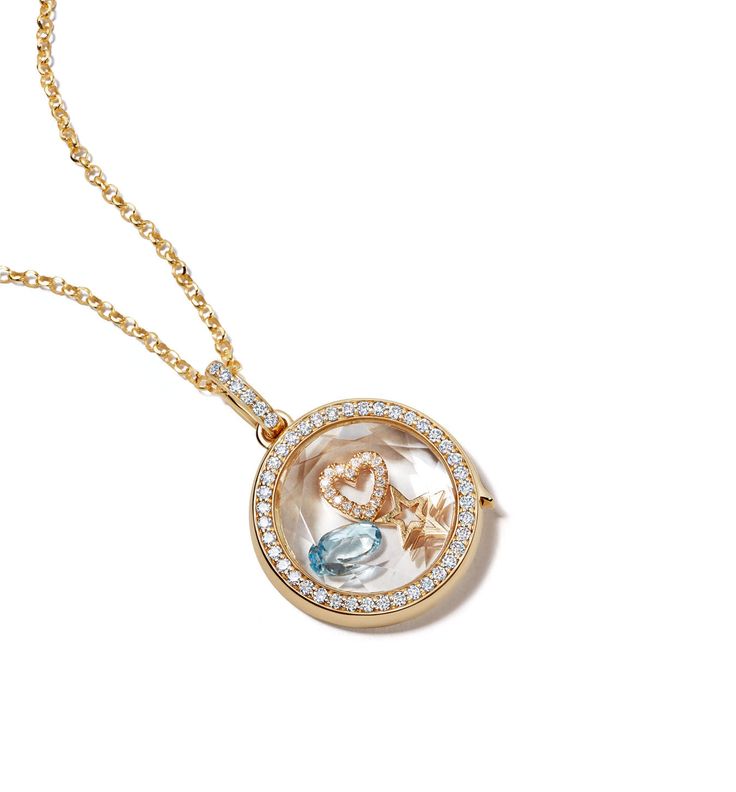 Loquet London specializes in creating joy and memories through handcrafted keepsakes. Using the most ardent care and sustainable practices, each token is hand-finished, so that it is utterly unique and made to last. This locket is inspired by the idea of keepsakes and collecting memories, as a love letter coded in charms. This diamond locket pendant is hand-crafted in 14-karat solid yellow gold and is outlined with a single row of brilliant G VS diamonds and set with a faceted clear sapphire cry Luxury Necklace With Detachable Pendant For Keepsake, Luxury Coin Shaped Locket Necklaces, Luxury Coin Locket Necklaces, Luxury Keepsake Locket Necklace With Round Pendant, Luxury Wedding Locket Necklace With Round Pendant, Luxury Polished Round Pendant Locket Necklace, Luxury Round Pendant Locket Necklace For Keepsake, Luxury Round Pendant Locket Jewelry, Luxury Polished Locket Necklace Gift