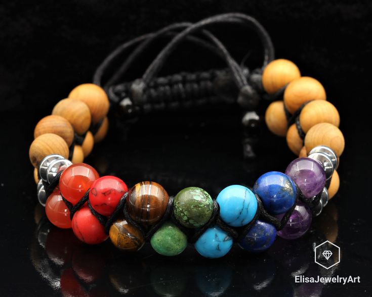 "Healing 7 Chakra Beads & Wooden Beads Double Adjustable Bracelet Healing Gemstone Crystal Macrame Bracelets Healing Energy Gift for Him -ALL THE PRODUCTS AT ELISAJEWELRYART ARE HANDMADE AND MADE WITH NATURAL BEADS. Chakra Colors Let's look at the 7 Chakra colors: 1- RED - The Root Chakra 2- ORANGE - The Navel or Sacral Chakra 3- YELLOW - The Solar Plexus Chakra 4- GREEN - The Heart Chakra 5- BLUE - The Throat Chakra 6- INDIGO - The Third Eye Chakra 7- VIOLET - The Crown Chakra As you can see in Spiritual Braided Bracelets With Round Natural Stones, Healing Gemstone Beads Braided Bracelets, Spiritual Multicolor Braided Bracelets With Round Beads, Adjustable Multicolor 8mm Beaded Jewelry, Spiritual Hand Wrapped Round Beads Friendship Bracelet, Adjustable Gemstone Braided Bracelets, Adjustable Braided Bracelets With Gemstone Beads, Adjustable Braided Bracelets With 8mm Beads For Healing, Crystal Macrame