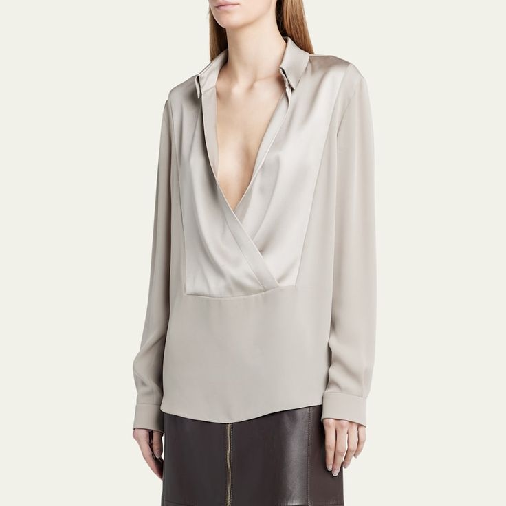 Giorgio Armani silk georgette blouse features a wrap front styling  V-neckline; spread collar  Long sleeves Back yoke  Mid-length  Relaxed fit  Silk Dry clean Made in Italy Elegant Formal V-neck Top, Elegant V-neck Wrap Top For Work, Designer Silk V-neck Blouse, Formal Silk V-neck Top, Luxury V-neck Top For Spring, Elegant Silk Blouse With Lapel Collar, Designer Silk V-neck Tops, Elegant Silk Tops With Lapel Collar, Elegant Wrap Top With Surplice Neckline For Work