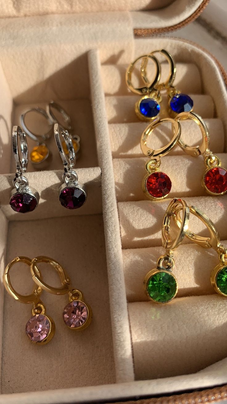 Gold or silver plated gemstone earrings! (message me about any questions on colours) * pick from gold or silver plated  * and choose your gemstone to keep good care of your jewellery: * avoid leaving in direct sunlight  * remove before showering or exercising * if wet, dry with towel  * any issues with your order please contact me for a refund or replacement  Check out my Instagram @sophsearringshop ♥️ Single Crystal Earring As A Gift, Crystal Drop Earrings As A Gift, Round Crystal Earrings With Crystal Stones As A Gift, Silver Crystal Earrings Gold Plated For Anniversary, Silver Crystal Gold-plated Earrings For Anniversary, Party Jewelry With Birthstone In Cubic Zirconia, Cubic Zirconia Birthstone Jewelry For Party, Sparkling Stone Dangle Earrings As Gift, Gift Drop Earrings With Sparkling Stones