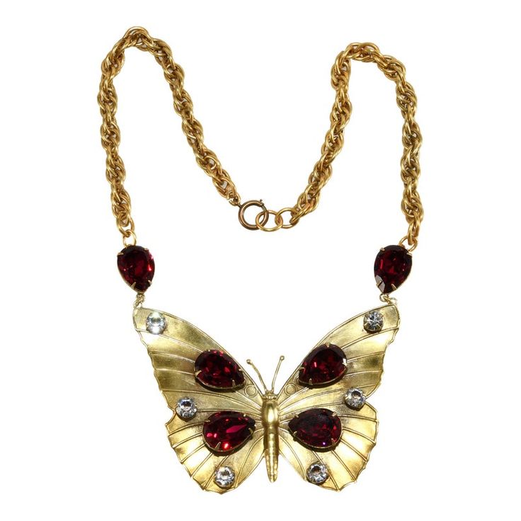 This is part of Chairish’s Costume Jewelry assortment.  This is Joseff of Hollywood's butterfly necklace with rich red pear shaped stones and sparkling clear accents. The finish on this piece is the same Russian gold plating Joseff of Hollywood used on jewelry made for use under movie studio lighting. Marked Joseff on the back. The butterfly measures 3 1/2" long and 2 1/2" wide; the total length of the necklace is about 19". Condition is excellent. This piece was purchased directly from Joseff o Red Rhinestone Evening Necklaces, Red Rhinestone Evening Necklace, Red Rhinestone Necklaces For Evening, Evening Red Rhinestone Necklace, Red Butterfly Charm Necklace, Red Pear, Movie Studio, Round Rock, Accessories Jewelry Necklace