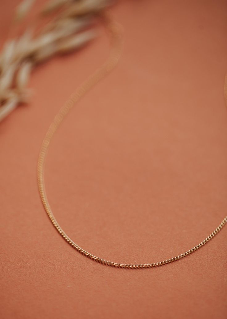 A true favorite around here. We love this dainty curb chain all on it’s own or paired with something a little bolder. Adjustable from 13-15" with a 2" extender. Available in 14kt Gold Fill + Sterling Silver. Juliann pairs it with our Gemma Trio Necklace in Mist. Handmade in Eau Claire, WI. Our jewelry is handmade so each piece will be unique and may vary slightly from what is pictured. Delicate 14k Gold Curb Chain Jewelry, Everyday Rose Gold Curb Chain Necklace, Everyday Rose Gold Necklace With Curb Chain, 14k Gold Dainty Curb Chain Jewelry, Delicate Cuban Link Chain Necklace For Everyday, Everyday 14k Gold Curb Chain Jewelry, Everyday 14k Gold Box Chain Necklace, Everyday Minimalist Necklace With Curb Chain, Minimalist Everyday Curb Chain Necklace