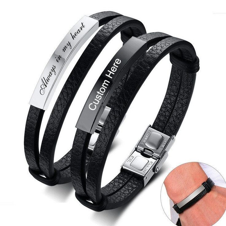 two black leather bracelets with engraved words on them