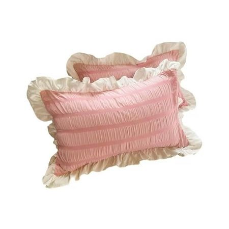 two pink pillows with ruffled edges