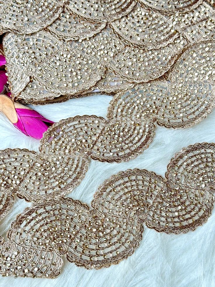 This beautiful trim embroidered with cutdanna glasswork beads, zari and sequence embroidery in silver colour is delicately adorned to enhance  your outfit with delicacy, simplicity, richness and glamour for all kind of traditional outfits, wedding dresses or evening gowns.  We are constantly adding new items and you will be sure to find our complete inventory with 1000's of designs at www.lacetrimssindia.com PLEASE NOTE : ALL ORDERS ARE SHIPPED FROM THE INDIA RETURN POLICY *All broken case can b Festive Embellished Lace Sets, Festive Embellished Silver Sets, Festive Silver Embellished Set, Silver Embellished Festive Set, Glamorous Embroidered Wedding Sets, Embellished Silver Saree Set, Gold Embroidered Party Lehenga, Gold Embroidered Lehenga For Party, Party Lehenga With Stone Work For Festivals