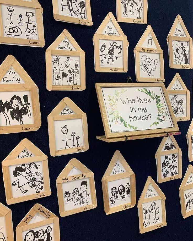 a group of children's drawings on wooden frames