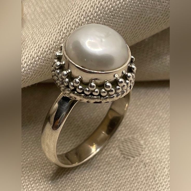 Introducing Our Stunning 925 Sterling Silver Pearl Rings Featuring Beautiful Granulation Accents And Intricate Twisted Wire Work. Perfect For Those Who Appreciate Fine Craftsmanship And Timeless Elegance. Https://Www.Instagram.Com/Reel/C7nz85mnvl7/?Igsh=Mzrlodbinwflza== Product Details: Product: Ring Metal: 925 Sterling Silver Sizes Available: Us 6, 8, And 9 Pearl Size: 10mm Round Total Weight: 7.25 Grams These Rings Showcase A Gorgeous Pearl Set In High-Quality Silver, Enhanced By Delicate Gran White Sterling Silver Fine Jewelry Rings, Fine Jewelry White Sterling Silver Rings, White Sterling Silver Pearl Ring, White Pearl Sterling Silver Ring, Hallmarked Sterling Silver Pearl Ring, Elegant Sterling Silver Cabochon Pearl Ring, White Sterling Silver Ring Jewelry, Classic White Moonstone Ring In Sterling Silver, Elegant Sterling Silver Pearl Ring Stamped 925