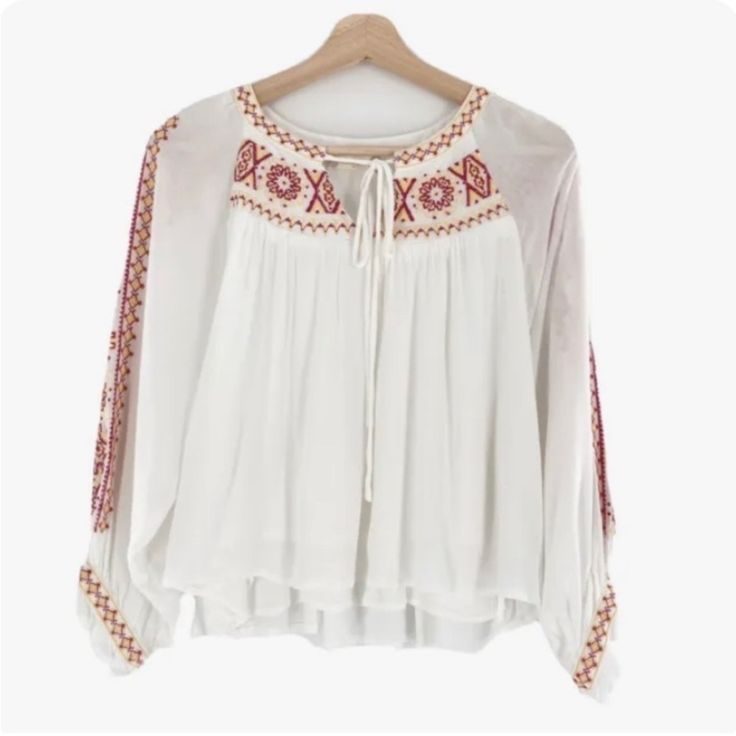 Nwt Altar’d State White Cropped Embroidered Blouse Size Small Lined 100% Rayon Embroidered Long Sleeve Blouse For Brunch, Long Sleeve Embroidered Blouse For Brunch, White Long Sleeve Blouse With Embroidered Hem, White Folk Top With Embroidered Sleeves, Vacation Long Sleeve Tops With Geometric Embroidery, White Bohemian Peasant Top With Embroidered Sleeves, White Folk Tops With Embroidered Sleeves, Bohemian White Peasant Top With Embroidered Sleeves, Long Sleeve Tops With Geometric Embroidery For Vacation