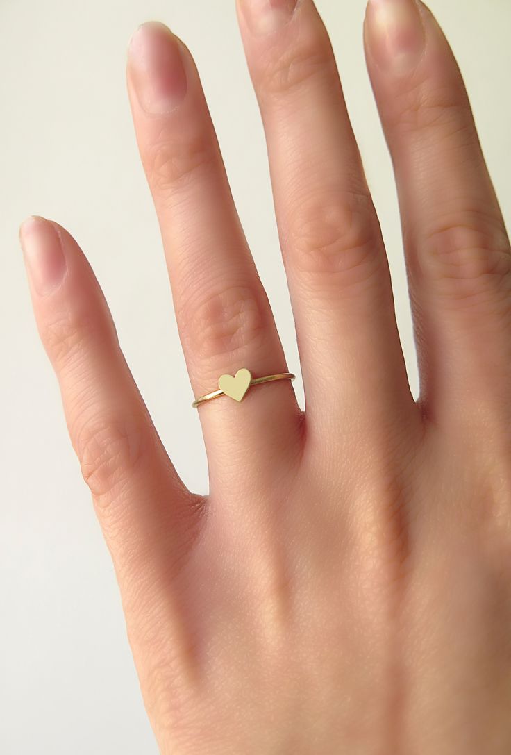 14K 9K Solid Gold Heart Ring, Delicate gold ring, Dainty Rose Gold heart ring, Love Romatnic Jewelry, Minimalist Stacking gold ring, Gift for her, Stackable gold ring, 14K rose gold ring, 9K rose gold ring, 9K gold ring, FREE EXPRESS SHIPPING Dainty 14K or 9K solid gold ring with a tiny heart. Love is always around, hear its whispers and embrace it. <3 More dainty gold rings here: https://www.etsy.com/shop/WhisperGold?ref=seller-platform-mcnav&section_id=23760120 ------------------------- Gold Heart-shaped Stackable Midi Rings, Dainty Stackable Heart Ring Gift, Gold Stackable Heart Midi Rings, Gold Stackable Rings With Heart Charm For Wedding, Delicate Tiny Heart Promise Ring, Dainty Heart Ring For Everyday, Tiny Delicate Heart Promise Ring, Delicate Heart Promise Ring, Dainty Heart Ring For Everyday Wear