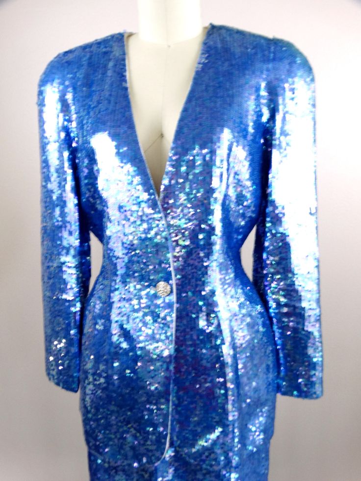 "This is an EXQUISITE hand sewn sequin dress and jacket! This ensemble is fully embellished with iridescent bright blue sequins. It's in perfect condition! Jacket Bust - 38/40\" Jacket Waist - 30\" Jacket Length - 29\" Skirt Waist - 28\" Skirt Hips - 40\" Skirt Length - 20\" This dress comes from a pet-free and smoke-free home. If you would like more info or have any questions, please don't hesitate to ask!" Sequin Suit Women, Sequin Suit, Blue Sequin Dress, Checkered Jacket, Beaded Jacket, Dress And Jacket, Iridescent Blue, Sequin Jacket, Dress Suit