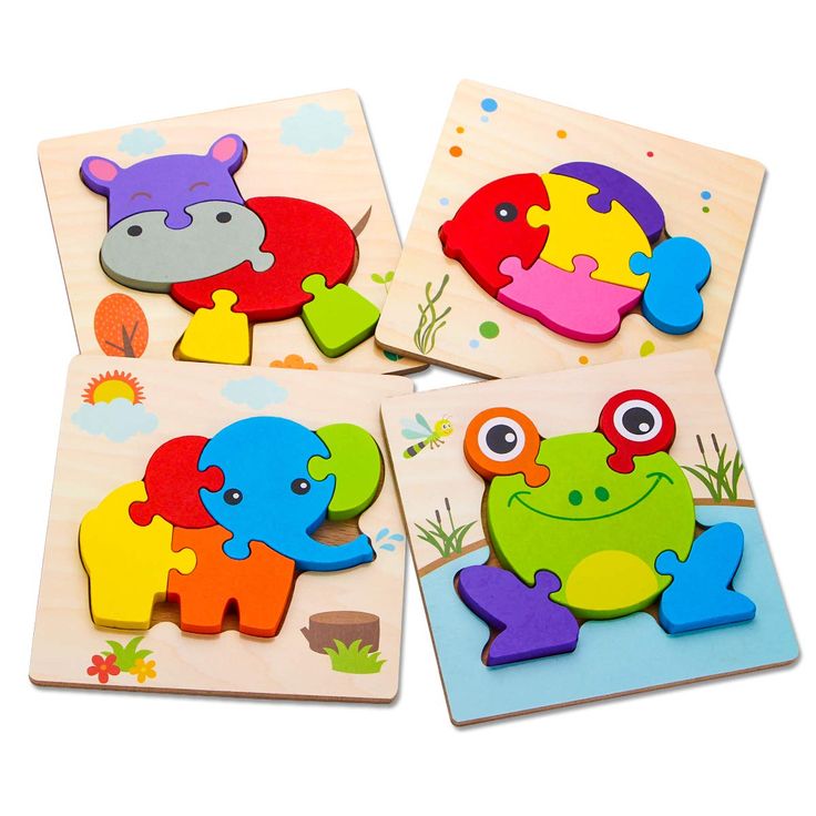 four wooden puzzles with different animals on the top one has an elephant, frog and fish design