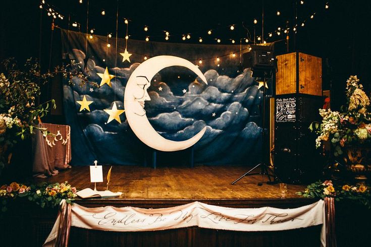 the stage is decorated with stars and moon decorations