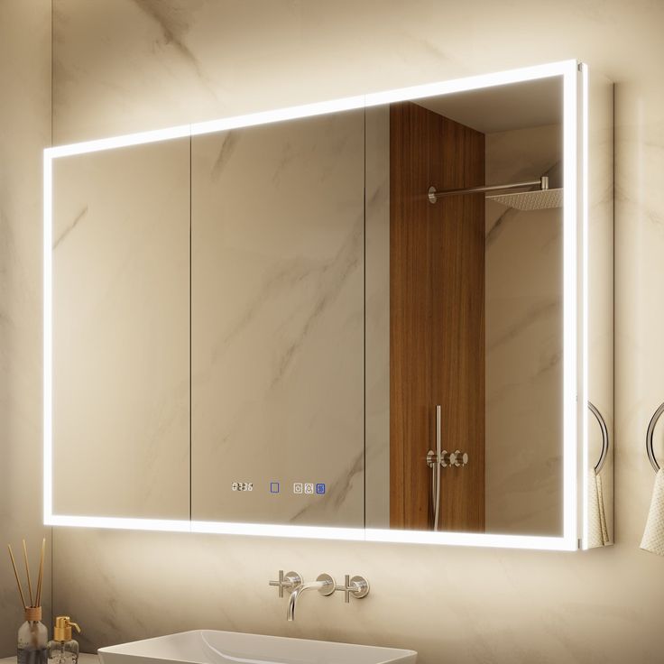 a bathroom sink sitting under a large mirror